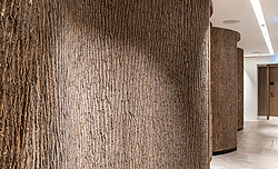 Massive natural Bark House® poplar bark around a curve as part of the Anima Mentis, Vienna health concept, by Freund GmbH